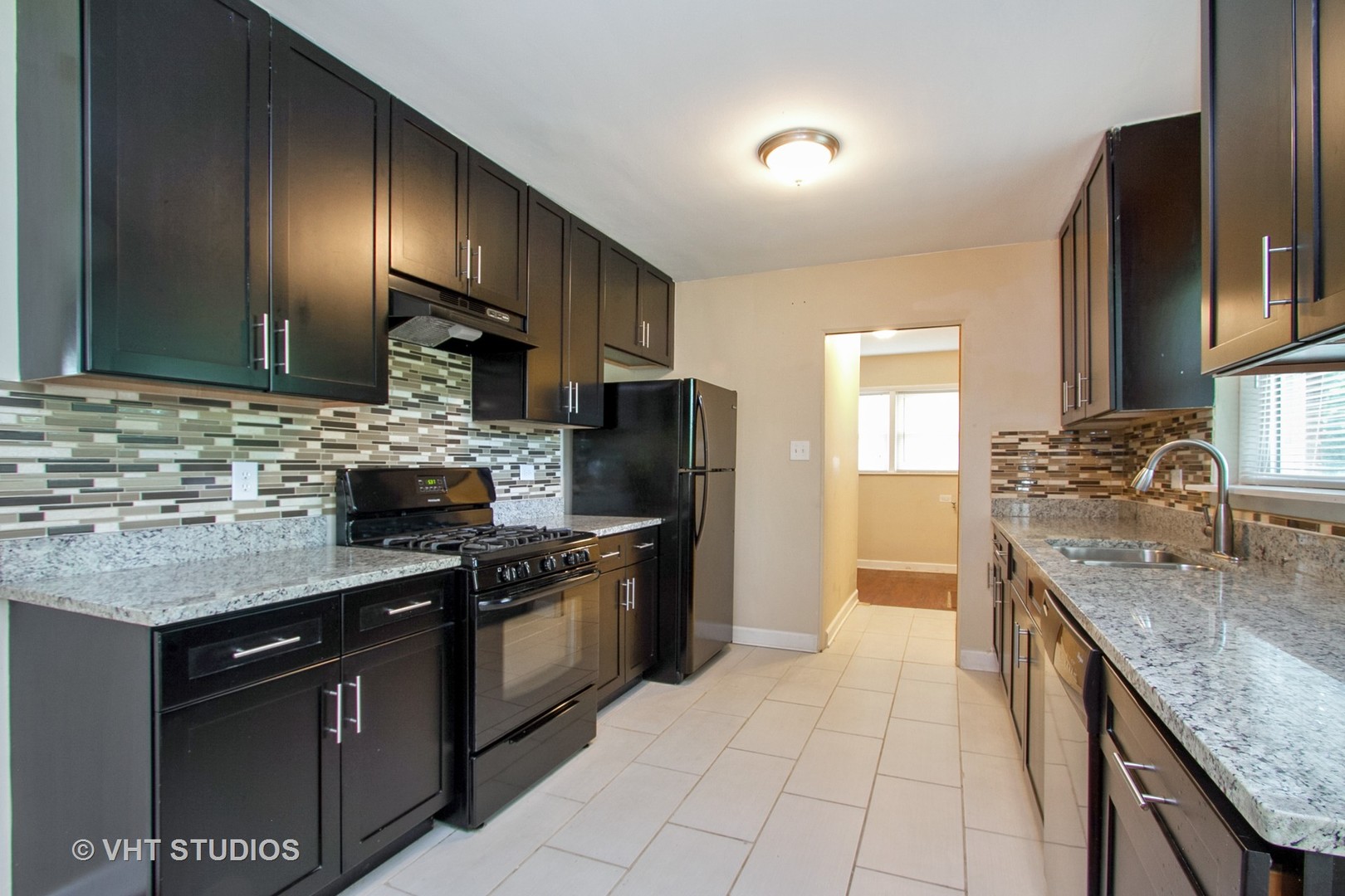 1008 Braemar Road Flossmoor, IL 60422 - Photo 3 of 10 a kitchen with stainless steel appliances granite countertop a sink stove and refrigerator