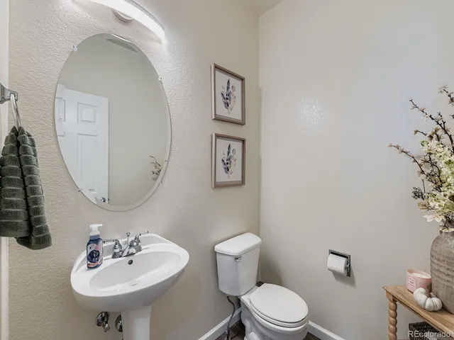a bathroom with a sink a mirror and a toilet