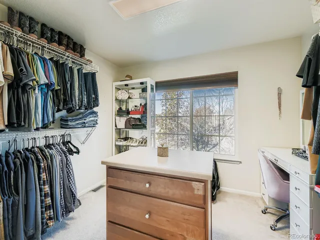 a room with a walk in closet and a window