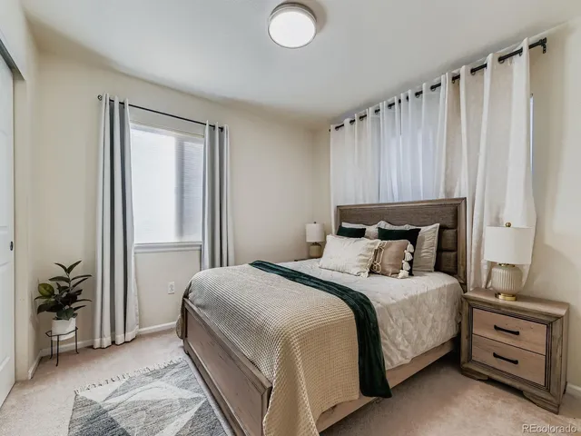 a bedroom with a bed and a cabinets