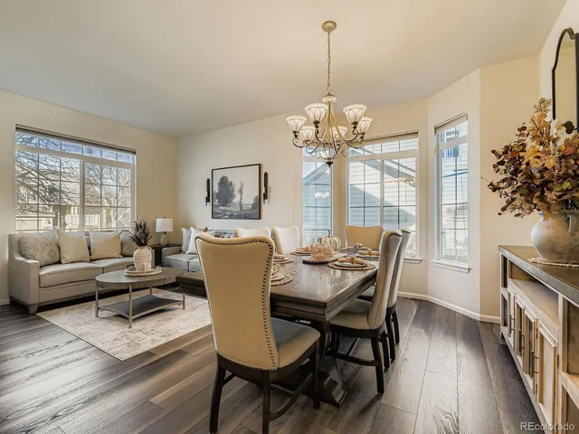 a view of a dining room with furniture window and wooden floor