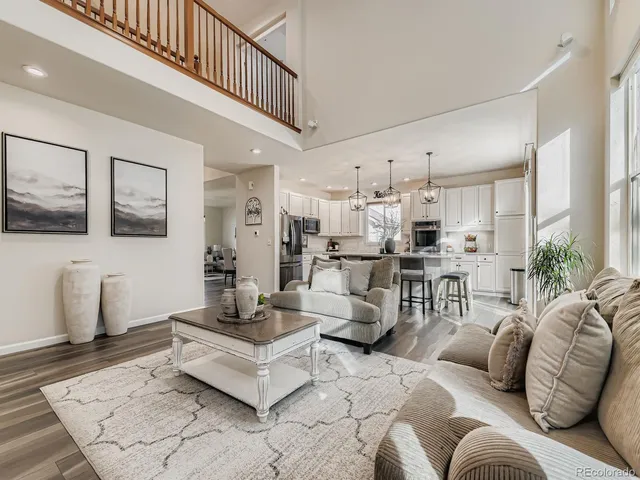 a living room with furniture and a table