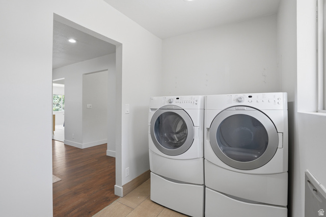 6889 South Village Road Salt Lake City, UT 84121 - Photo 25 of 44 Dedicated laundry area featuring tile flooring, and recessed lighting