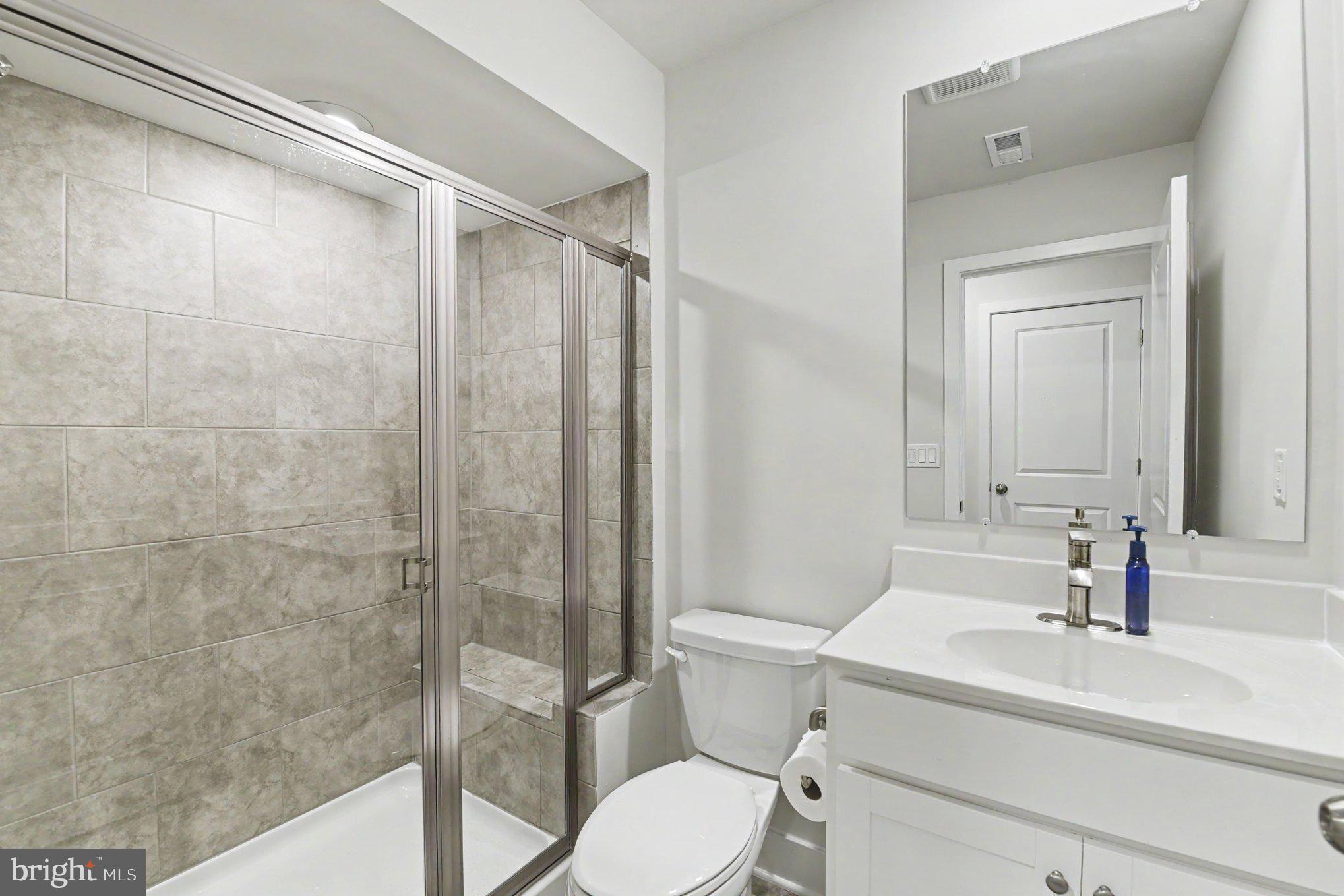 238 Waterstone Road Essex, MD 21221 - Photo 30 of 39 a bathroom with a sink toilet and shower