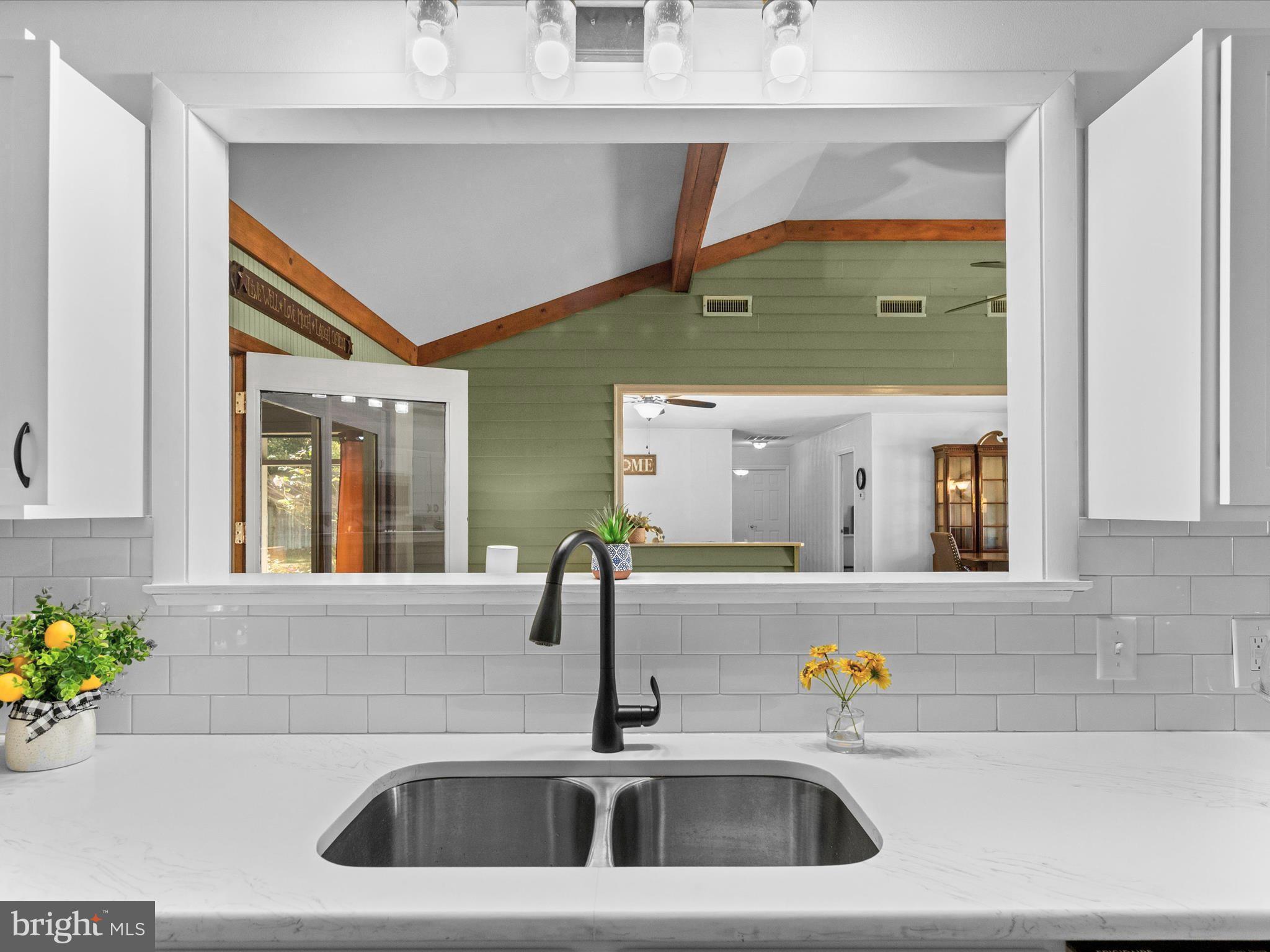 26905 Mt Vernon Road Princess Anne, MD 21853 - Photo 16 of 74 a bathroom with a sink and a mirror