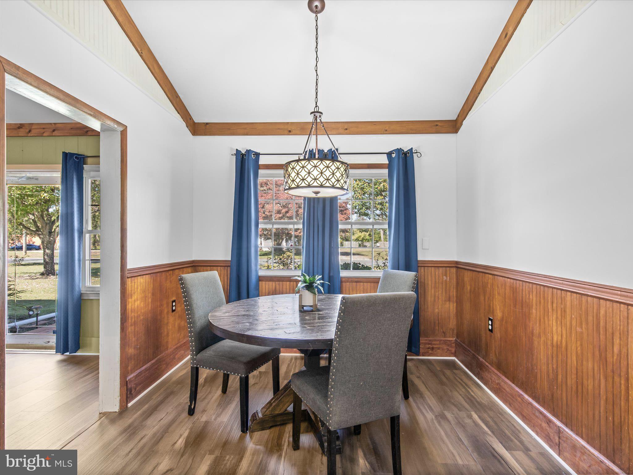 26905 Mt Vernon Road Princess Anne, MD 21853 - Photo 18 of 74 a view of a dining room with furniture window and wooden floor