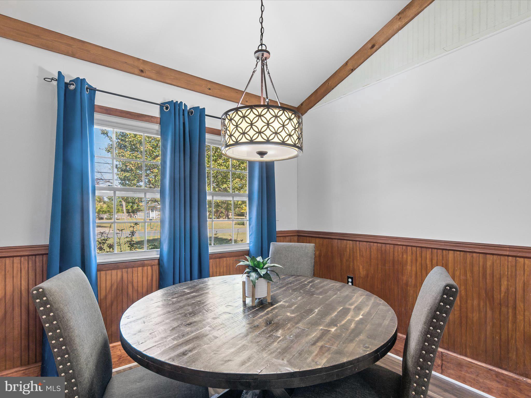 26905 Mt Vernon Road Princess Anne, MD 21853 - Photo 19 of 74 a view of a dining room with furniture window and outside view