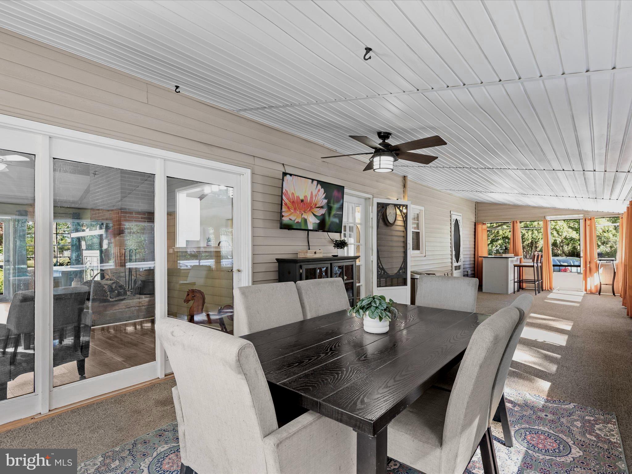 26905 Mt Vernon Road Princess Anne, MD 21853 - Photo 20 of 74 a view of a dining room with furniture window and outside view