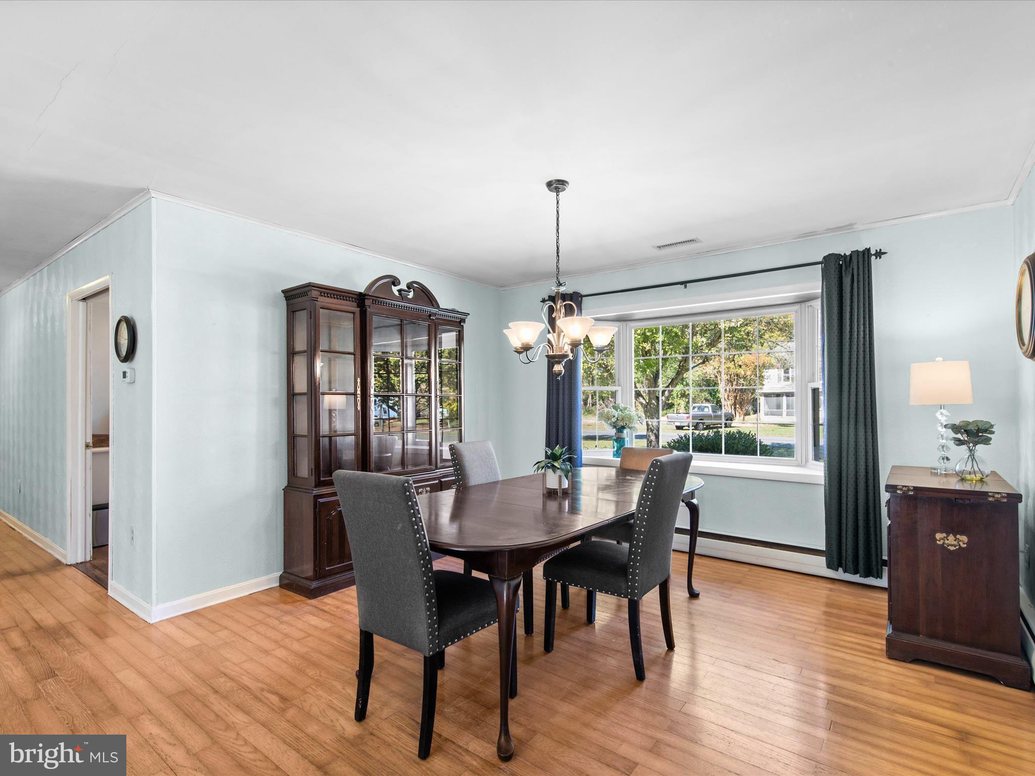 26905 Mt Vernon Road Princess Anne, MD 21853 - Photo 27 of 74 a view of a dining room with furniture window and wooden floor