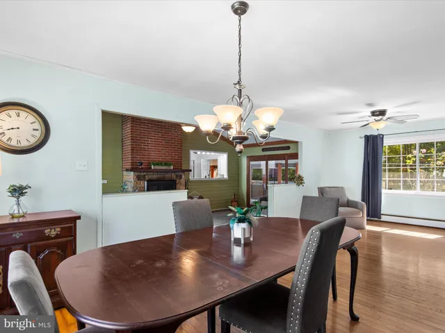 a bathroom with a sink mirror and toilet