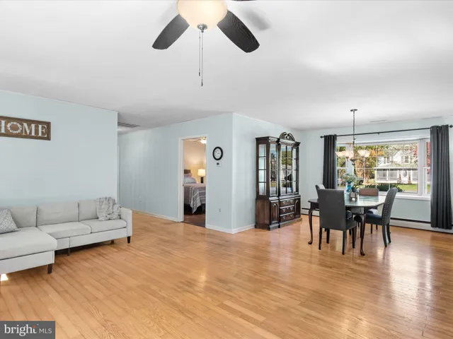 a view of room with window and hardwood floor