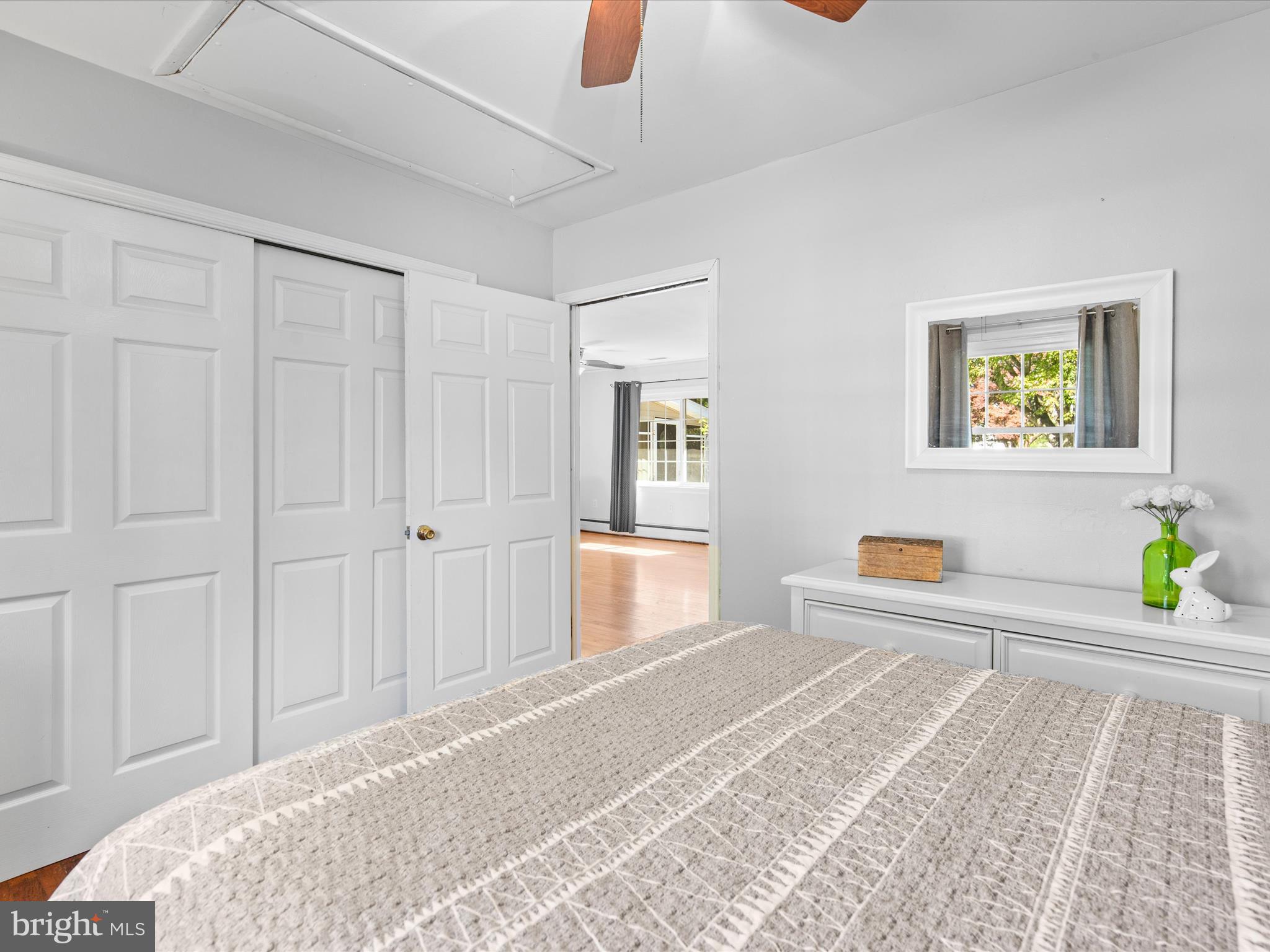 26905 Mt Vernon Road Princess Anne, MD 21853 - Photo 39 of 74 a bedroom with a bed and a chandelier