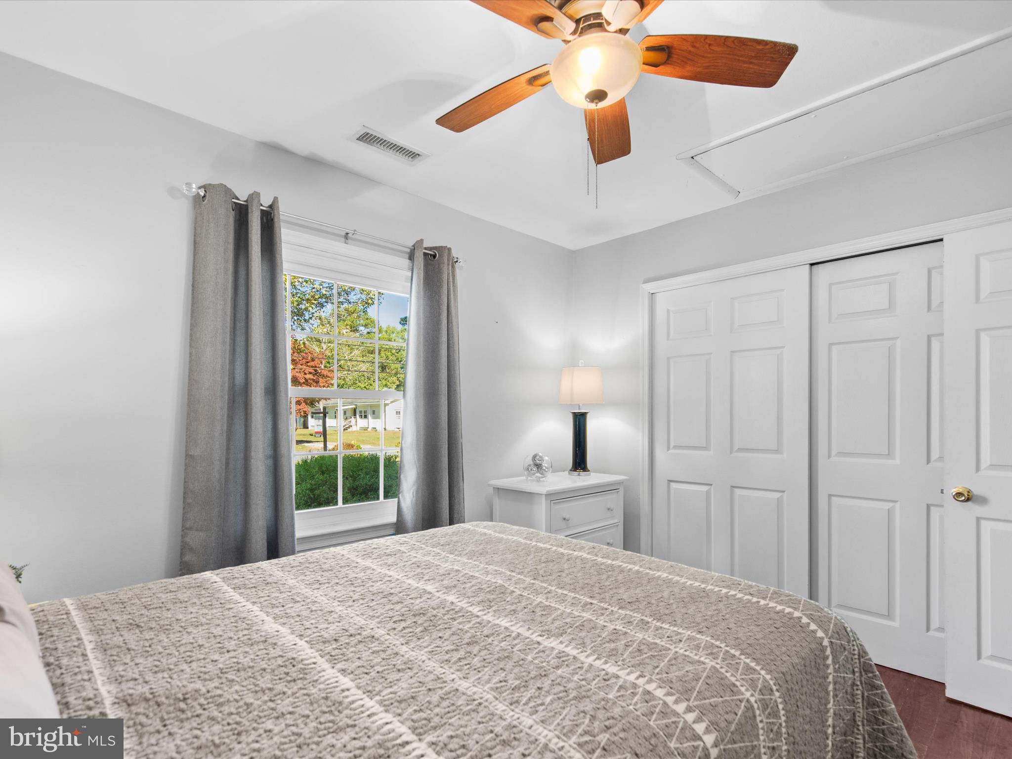 26905 Mt Vernon Road Princess Anne, MD 21853 - Photo 40 of 74 a bedroom with a bed and a chandelier