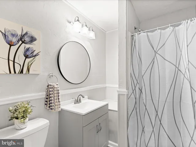 a front view of a house with a yard table and chairs