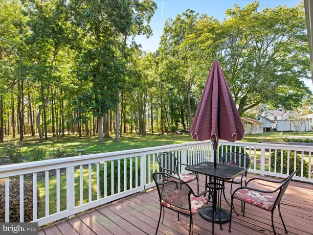 a view of a balcony with chairs