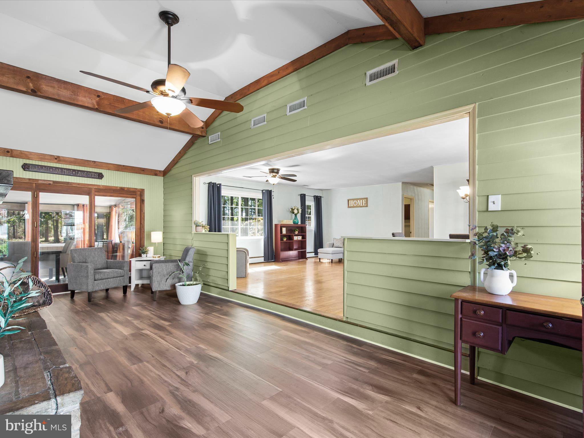 26905 Mt Vernon Road Princess Anne, MD 21853 - Photo 6 of 74 a view of a dining room with furniture window and wooden floor