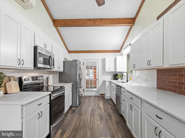 a kitchen with a sink and a window