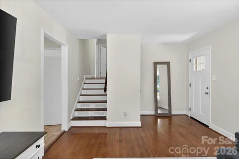 a view of an entryway with wooden floor
