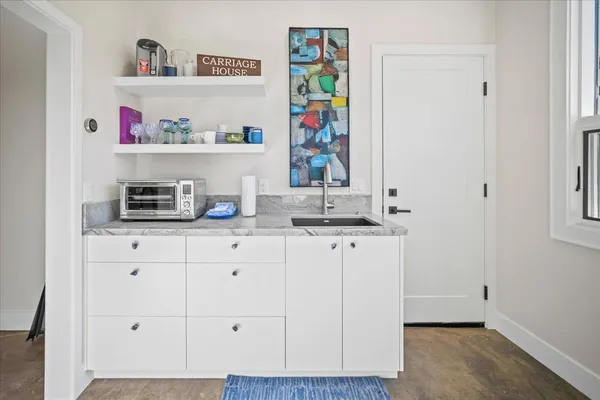 a kitchen with a refrigerator and cabinets
