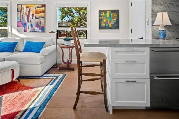 a living room with furniture and a rug