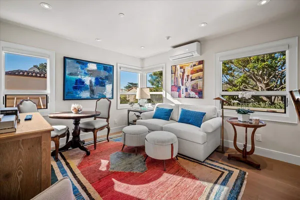 a living room with furniture or couch and a large window