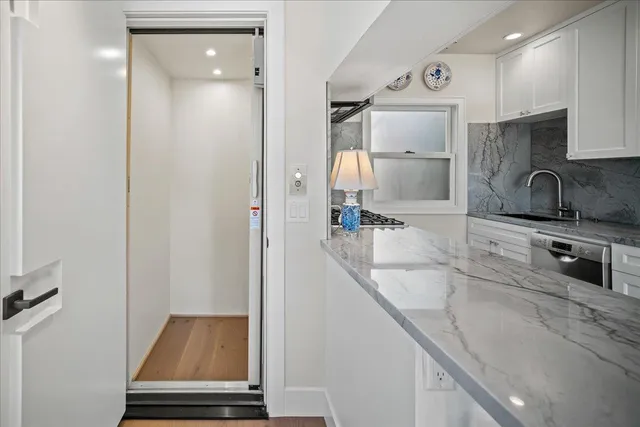 a kitchen with a sink and a refrigerator