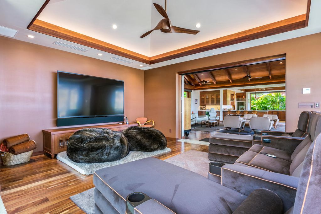 62-3908 Kaunaoa Iki Road Kamuela, HI 96743 - Photo 11 of 21 a living room with furniture a flat screen tv and a large window