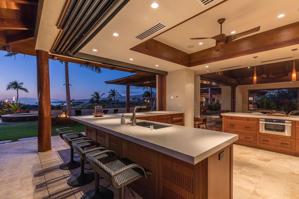 62-3908 Kaunaoa Iki Road Kamuela, HI 96743 - Photo 12 of 21 a kitchen with a sink a counter top space a stove and chairs