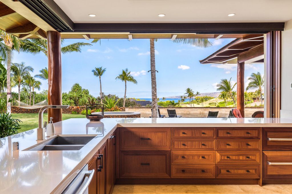 62-3908 Kaunaoa Iki Road Kamuela, HI 96743 - Photo 13 of 21 a kitchen with a sink and wooden cabinets