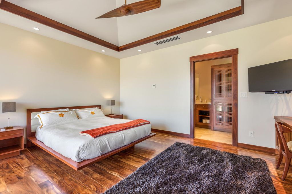 62-3908 Kaunaoa Iki Road Kamuela, HI 96743 - Photo 16 of 21 a bedroom with a bed and a flat screen tv