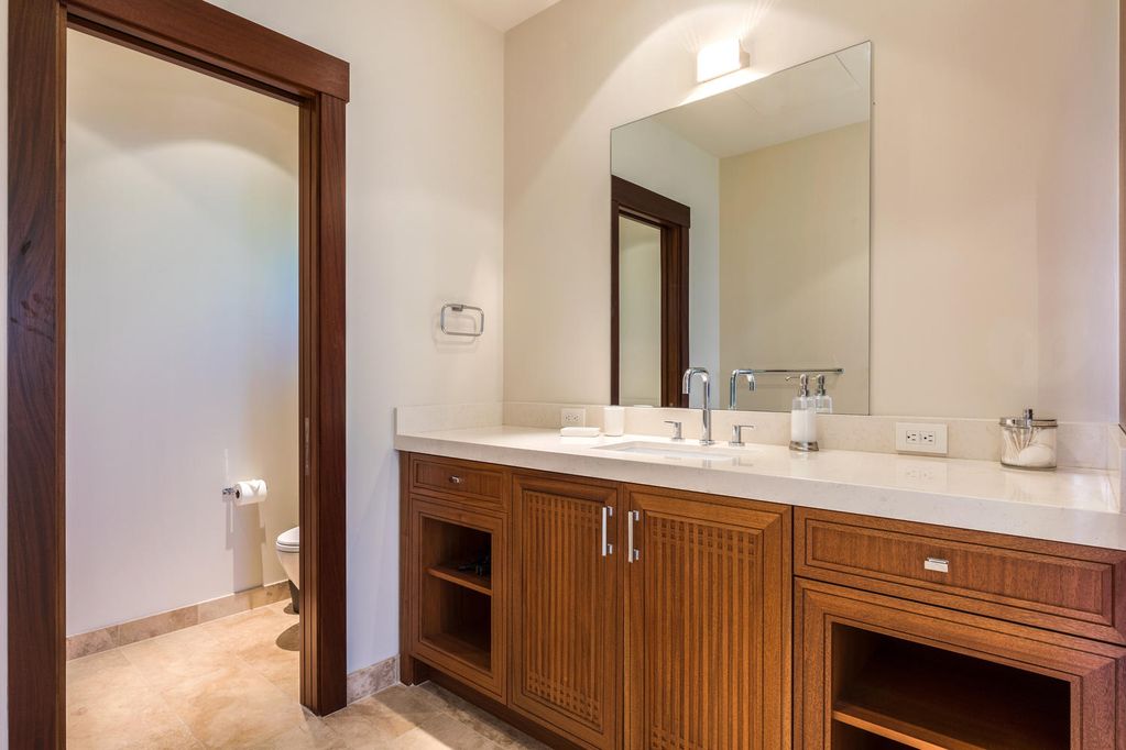 62-3908 Kaunaoa Iki Road Kamuela, HI 96743 - Photo 20 of 21 a bathroom with a granite countertop sink and a mirror