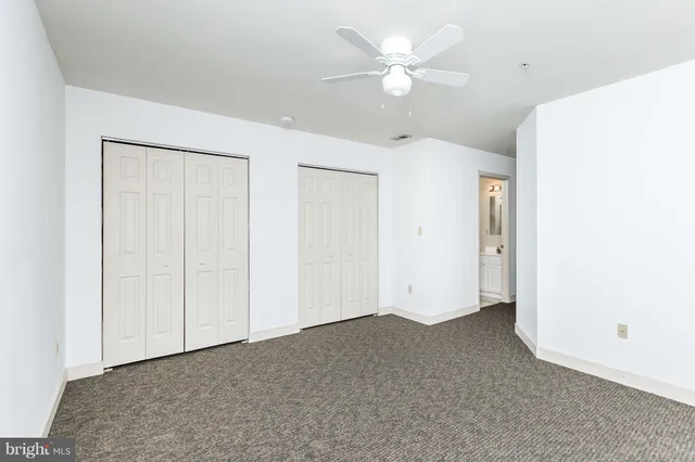 a bathroom with a sink toilet and window