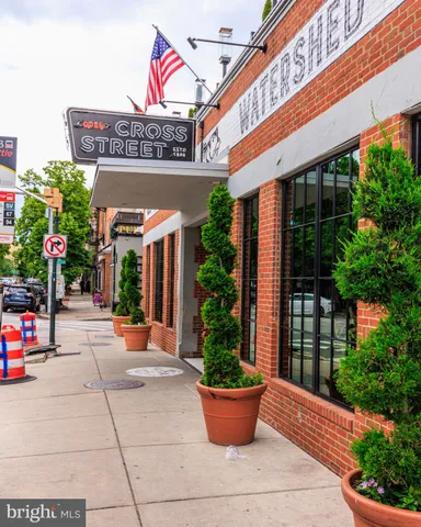 a sign that is on a pole on a street