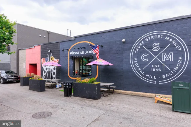 a view of street along with buildings and cars