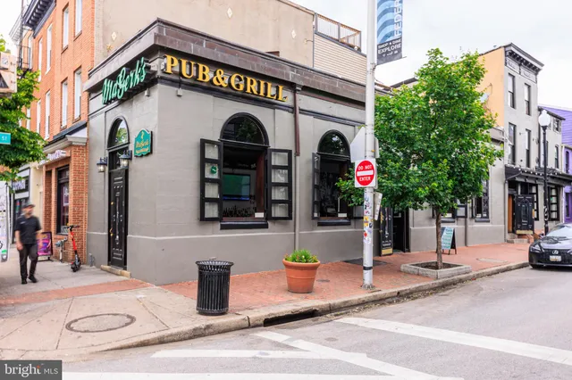 a view of a street with buildings in the background