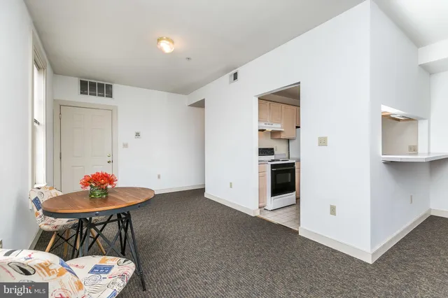 a living room with furniture and windows