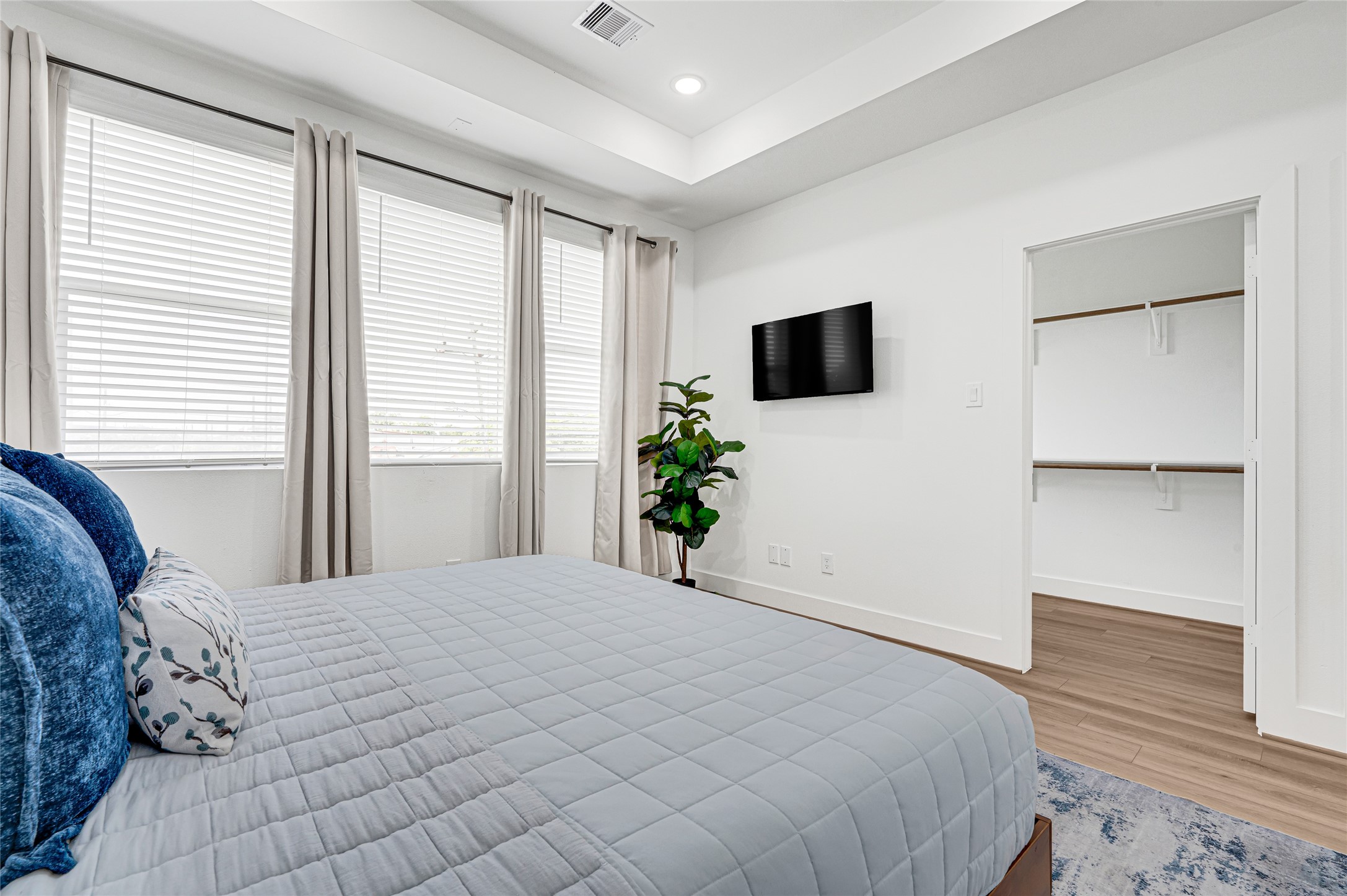 4201 Stassen Street Houston, TX 77051 - Photo 20 of 39 a bedroom with a large bed and a flat screen tv