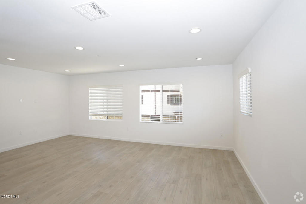 5250 Chesebro Road, Unit 13 Agoura Hills, CA 91301 - Photo 11 of 29 an empty room with a empty space and windows