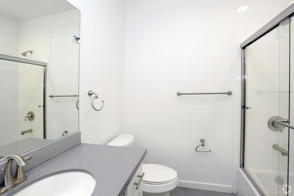 5250 Chesebro Road, Unit 13 Agoura Hills, CA 91301 - Photo 17 of 29 a white toilet sitting next to a bathroom sink