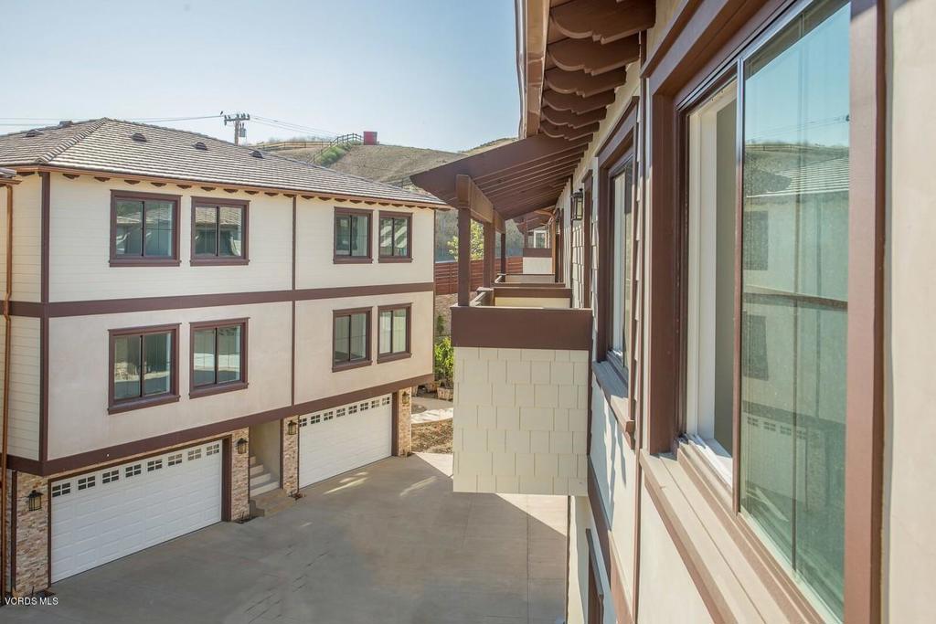 5250 Chesebro Road, Unit 13 Agoura Hills, CA 91301 - Photo 22 of 29 a view of a house with wooden fence