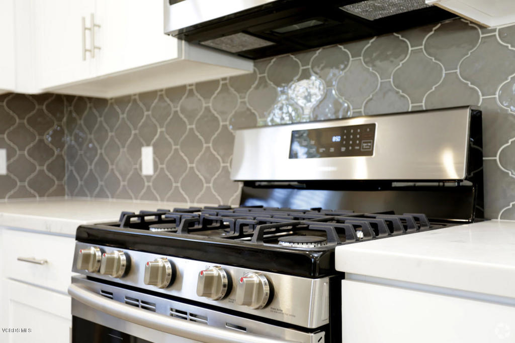 5250 Chesebro Road, Unit 13 Agoura Hills, CA 91301 - Photo 3 of 29 a stove top oven sitting inside of a kitchen