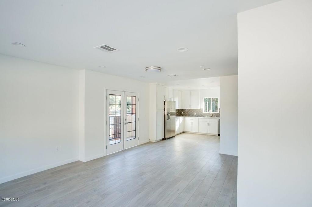 5250 Chesebro Road, Unit 13 Agoura Hills, CA 91301 - Photo 7 of 29 a view of a kitchen with wooden floor and a sink