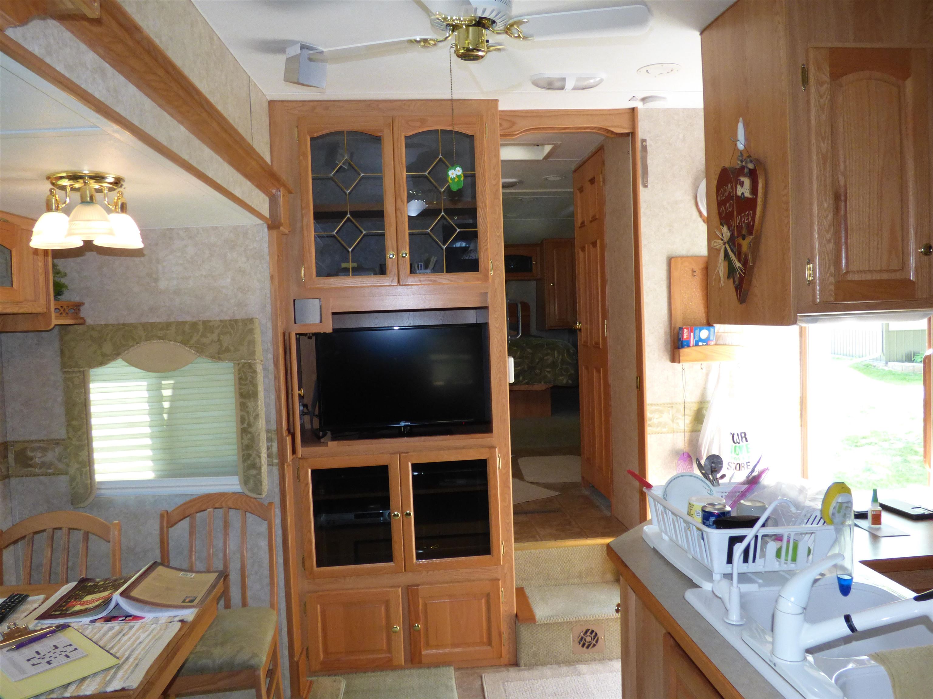 6384 A Diehl Road Savanna, IL 61074 - Photo 16 of 32 a living room with furniture and a flat screen tv