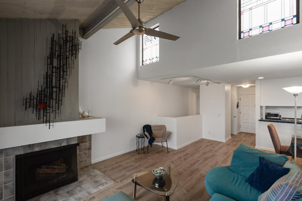 2101 Shore Line Drive, Unit 212 Alameda, CA 94501 - Photo 11 of 28 a living room with furniture and a fireplace