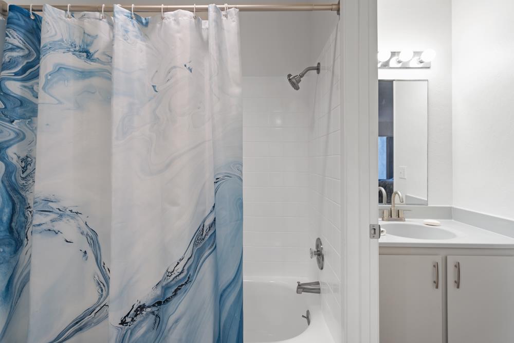 2101 Shore Line Drive, Unit 212 Alameda, CA 94501 - Photo 19 of 28 a bathroom with a bathtub and a sink
