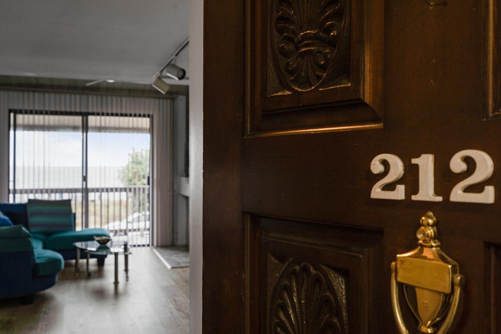 2101 Shore Line Drive, Unit 212 Alameda, CA 94501 - Photo 2 of 28 a view of a porch with furniture and floor to ceiling window