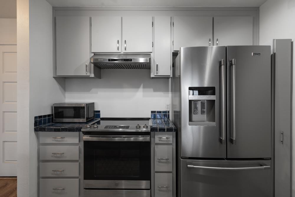 2101 Shore Line Drive, Unit 212 Alameda, CA 94501 - Photo 6 of 28 a kitchen with stainless steel appliances and refrigerator