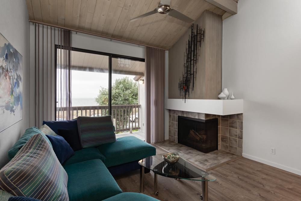 2101 Shore Line Drive, Unit 212 Alameda, CA 94501 - Photo 9 of 28 a living room with furniture and a fireplace