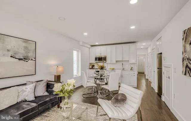 a living room with furniture and a table