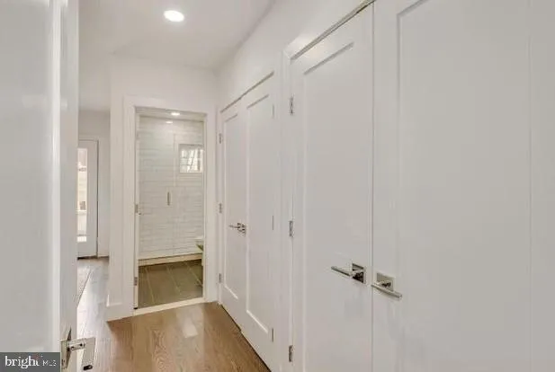 a bathroom with a shower and a glass door